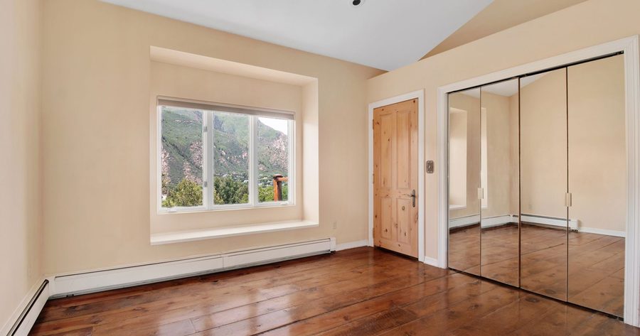Refinishing hardwood floors costs $1,000 to $2,500 for most jobs in 2026