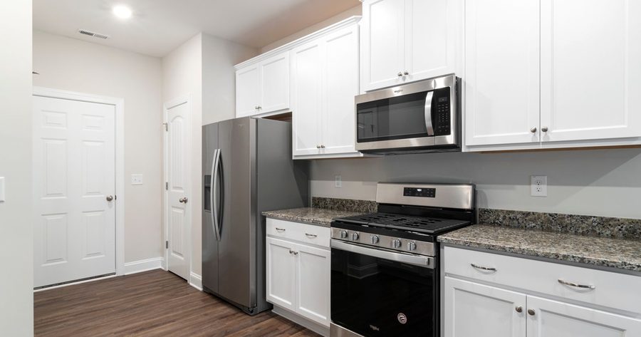 Painting kitchen cabinets costs $1,390 to $4,000 for most kitchens in 2026